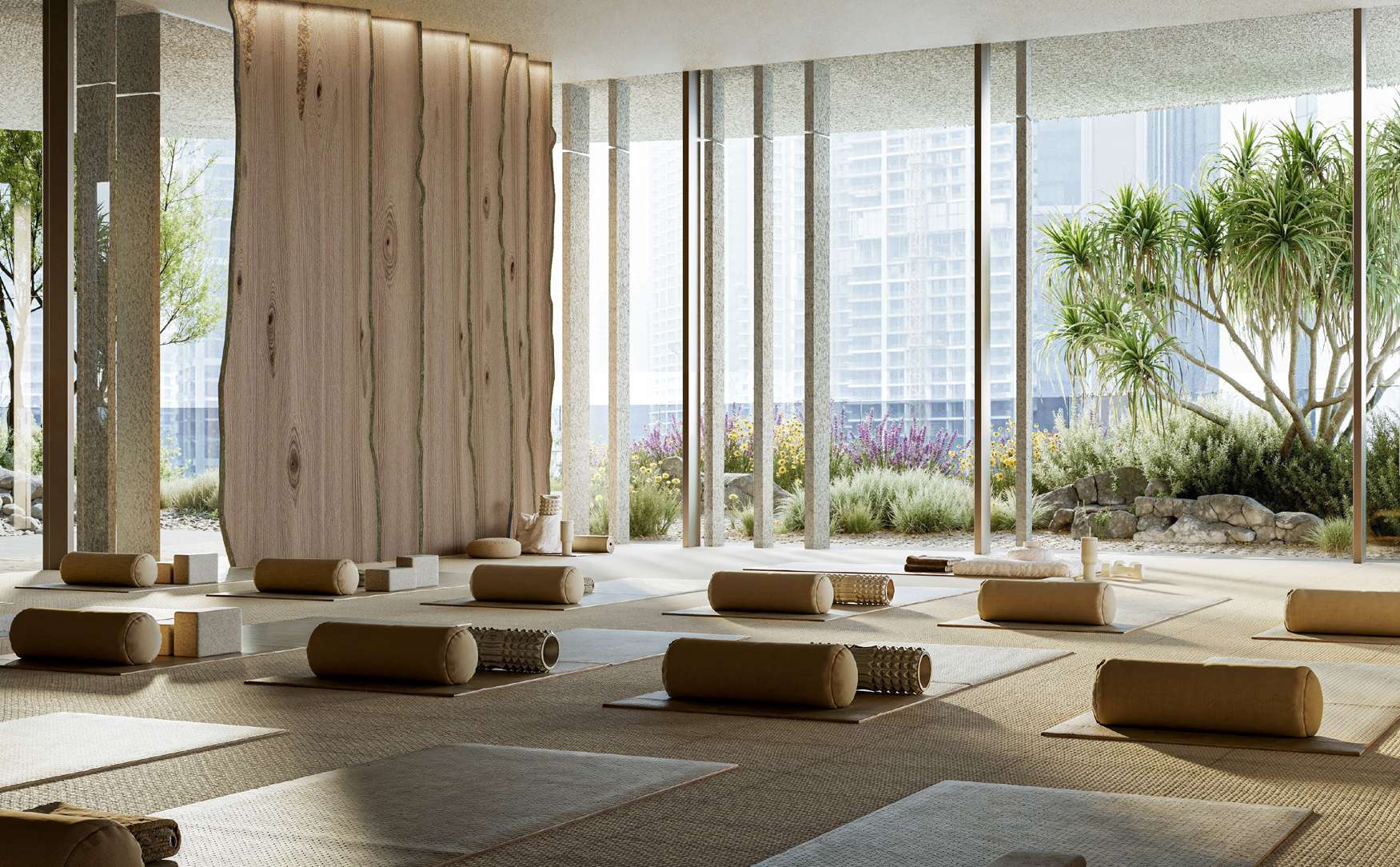 Airy yoga studio with timber wall, mats and garden views