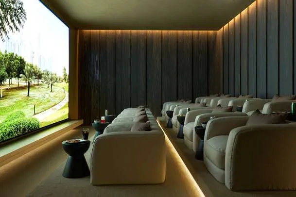 Private cinema with soft armchairs, timber walls and large screen