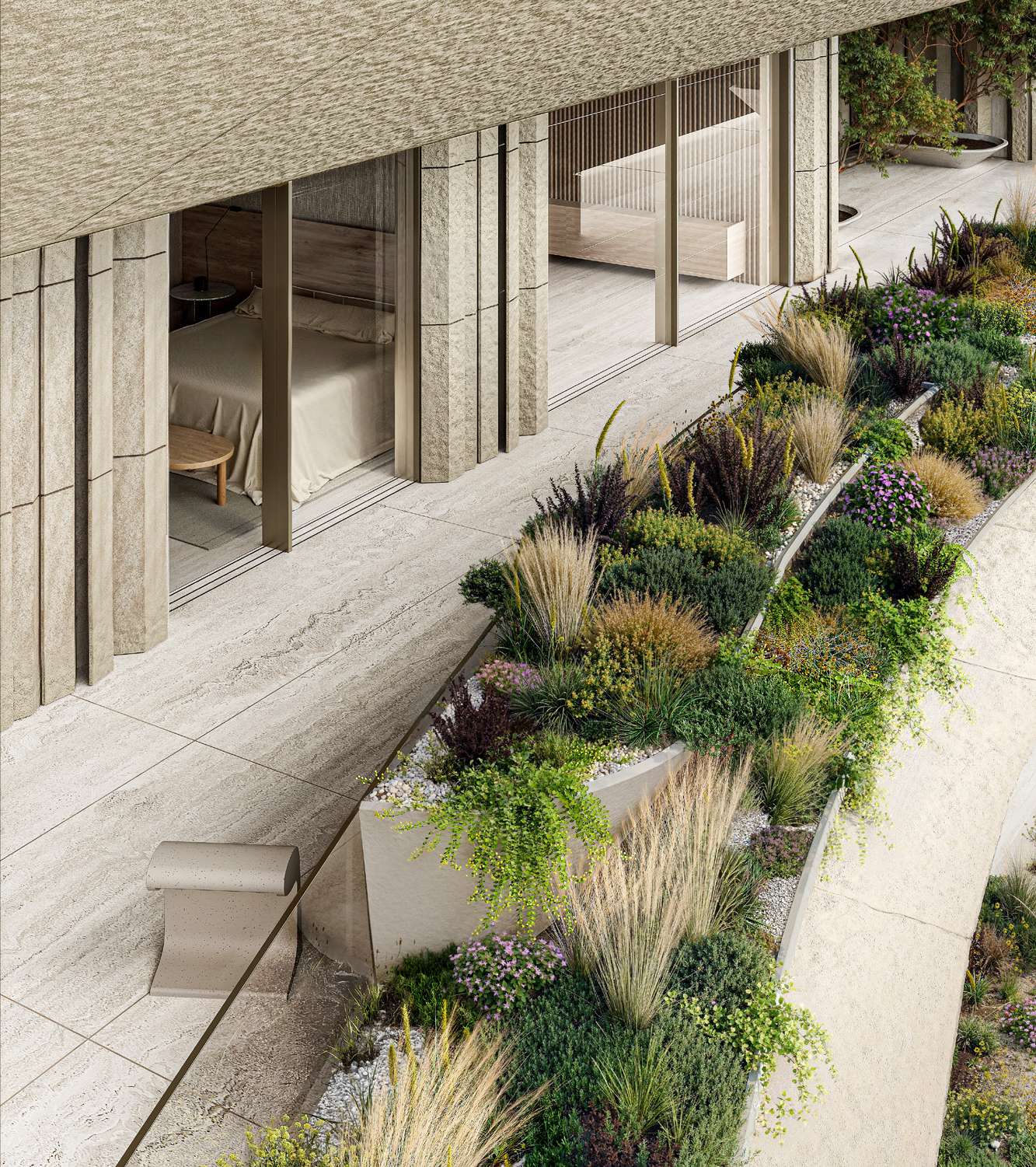 Stone terrace lined with lush planting outside a bedroom