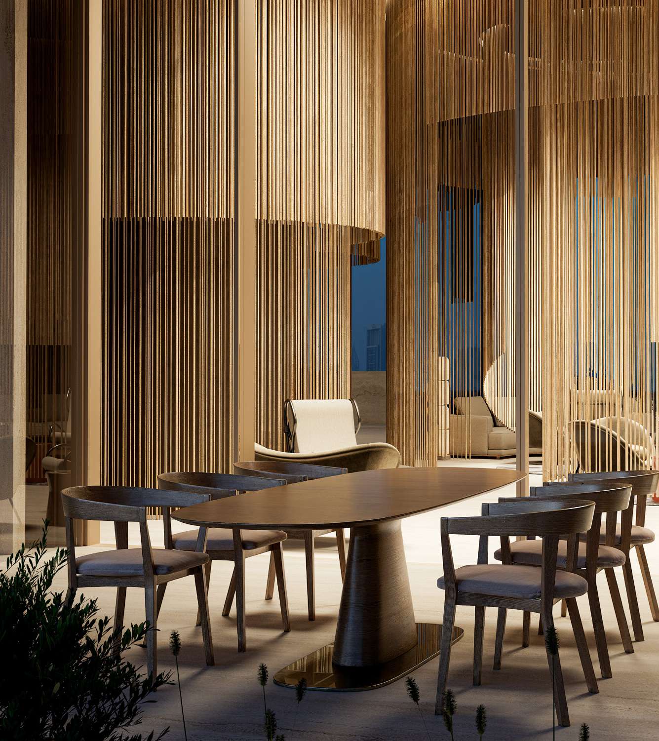 Oval dining table with timber chairs among golden hanging screens